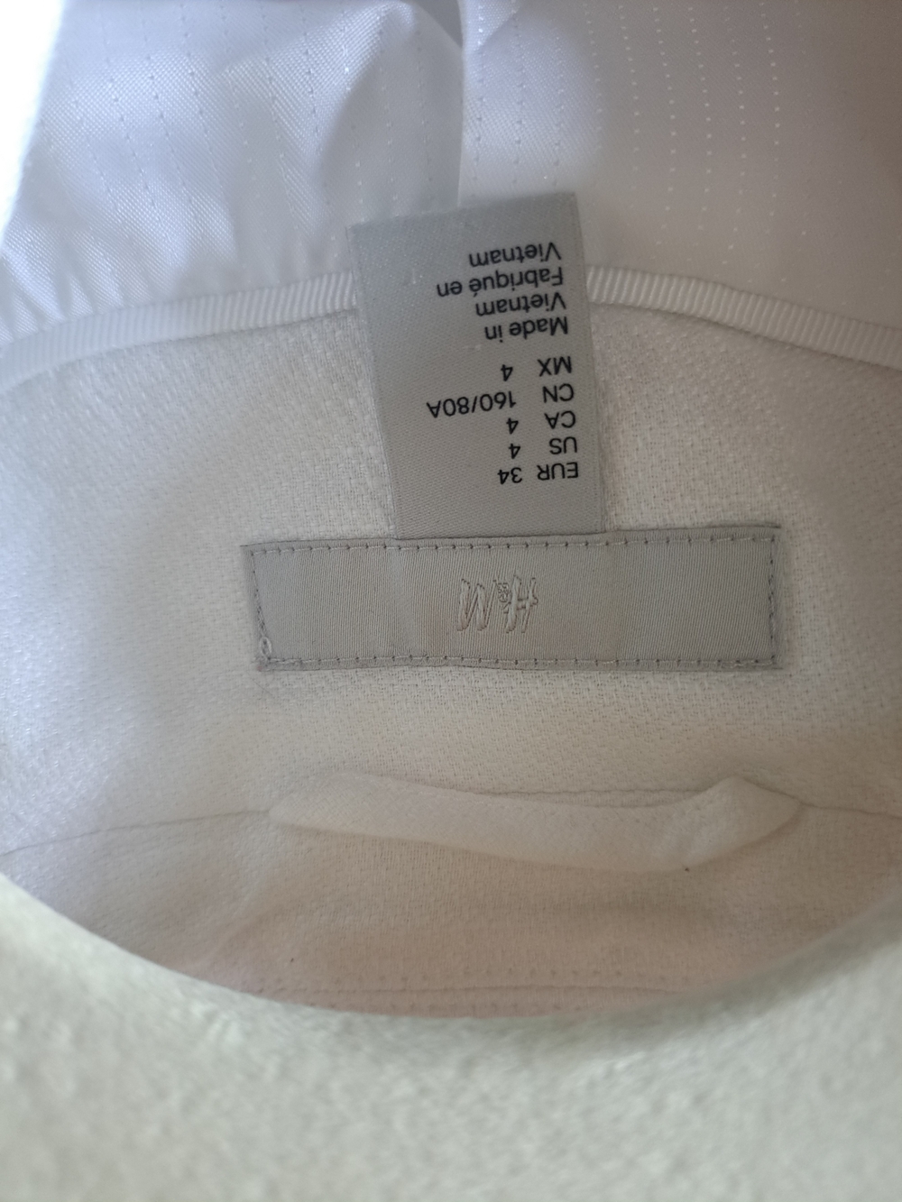 H&M White Textured Top with Subtle Logo